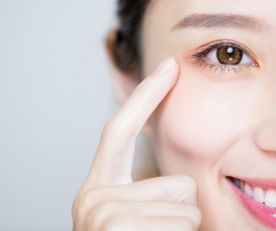 a woman pointing at her eye showing Digital eye strain 