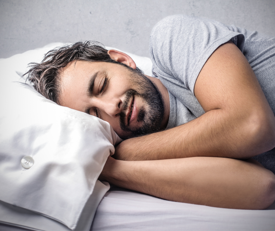 A man sleeping on a bed which improves eye health