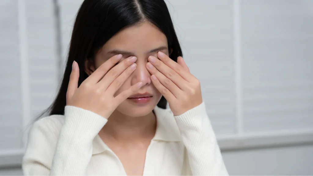 Woman rubbing heer eyes